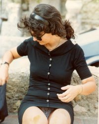 Seduta Per Strada A Taormina.jpg